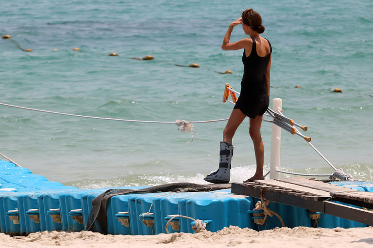 Accident Tourist Girl Are Walking Up By Crutches To The Floating