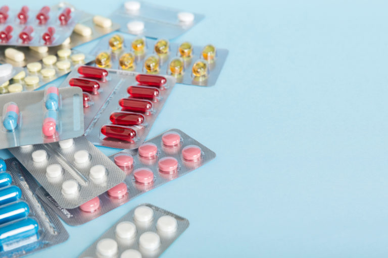 Too many different pill of various blisters with different pills Medicines storage at home concept Medication storing. A pile of medicine in blister packs. Pharmaceutical blister packs
