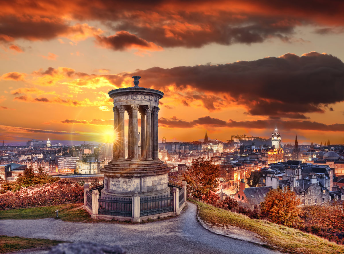 Edinburgh against sunset with Calton Hill in Scotland