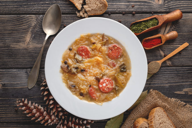 Slovak national christmas cabbage soup with mushrooms on natural background.
