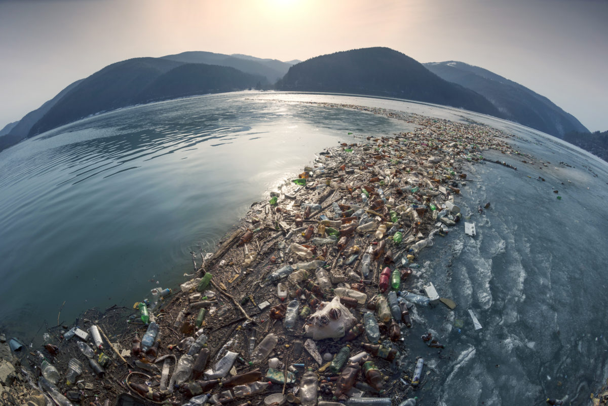 Spring flood and shore with garbage