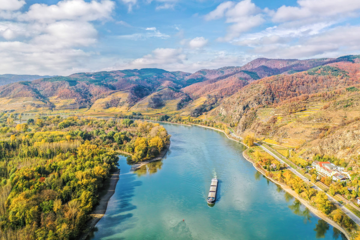 Panorama of Wachau valley with ship on Danube river during autumn in Austria