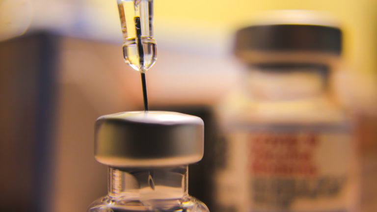 Thailand – SEPTEMBER  5. 2022: Closeup of biontech pfizer and moderna spikevax mrna covid 19 vaccination and vaccine vials epidemic.
