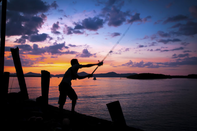 Man fishing , a marina , Thailan
