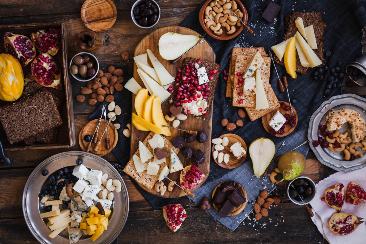 Assorted cheeses fruits nuts platter