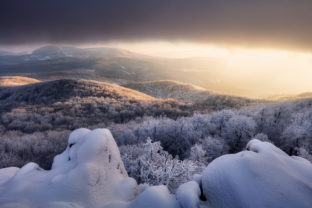 Panorama sunset colored sky winter snow clouds in Slovakia nature landscapes. Mountain sunset sky zoom in peak Vapenna frost.