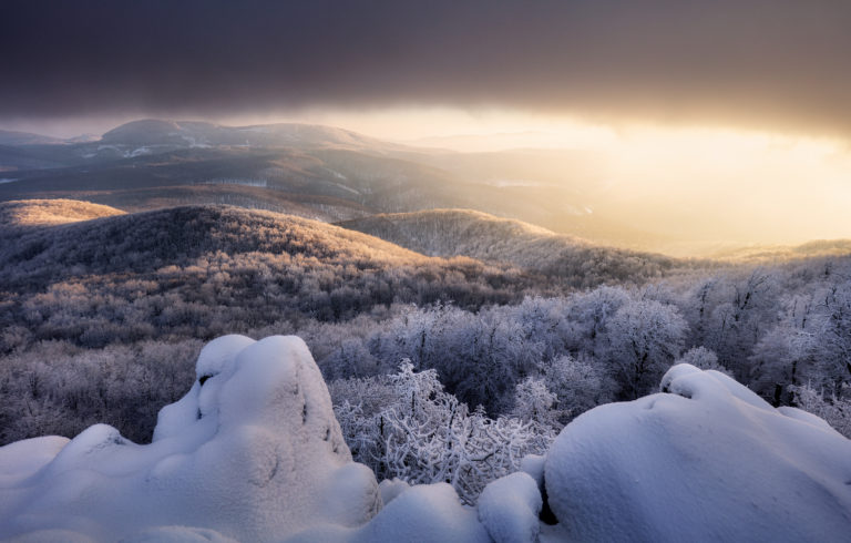Panorama sunset colored sky winter snow clouds in Slovakia nature landscapes. Mountain sunset sky zoom in peak Vapenna frost.