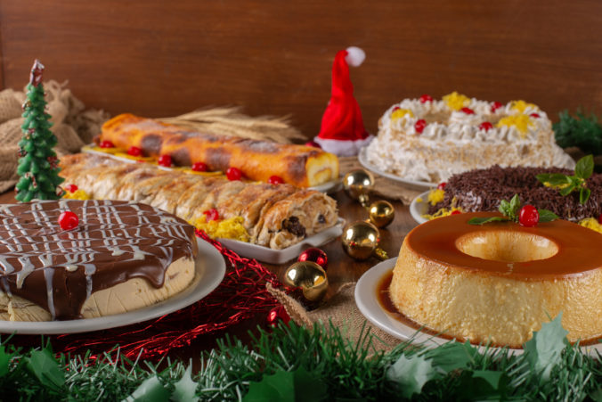 Assorted desserts and sweets for the Christmas party. Christmas dinner table front scene