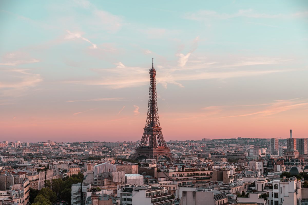 Drone shot of the Eifel tower and surrounding buildings in Paris, France