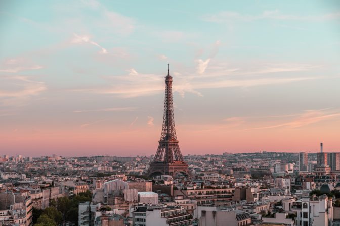 Drone shot of the Eifel tower and surrounding buildings in Paris, France