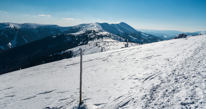 View from hiking trail near Velka hole hill summit in winter Nizke Tatry mountains in Slovakia