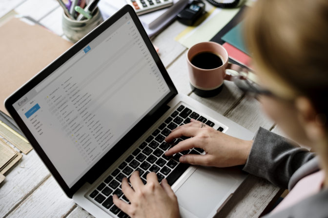 Businesswoman Checking E mail Online on Laptop