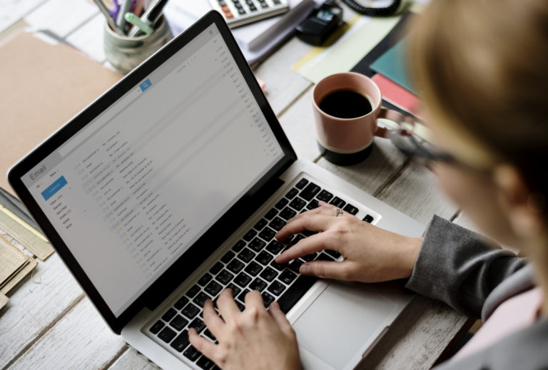 Businesswoman Checking E mail Online on Laptop