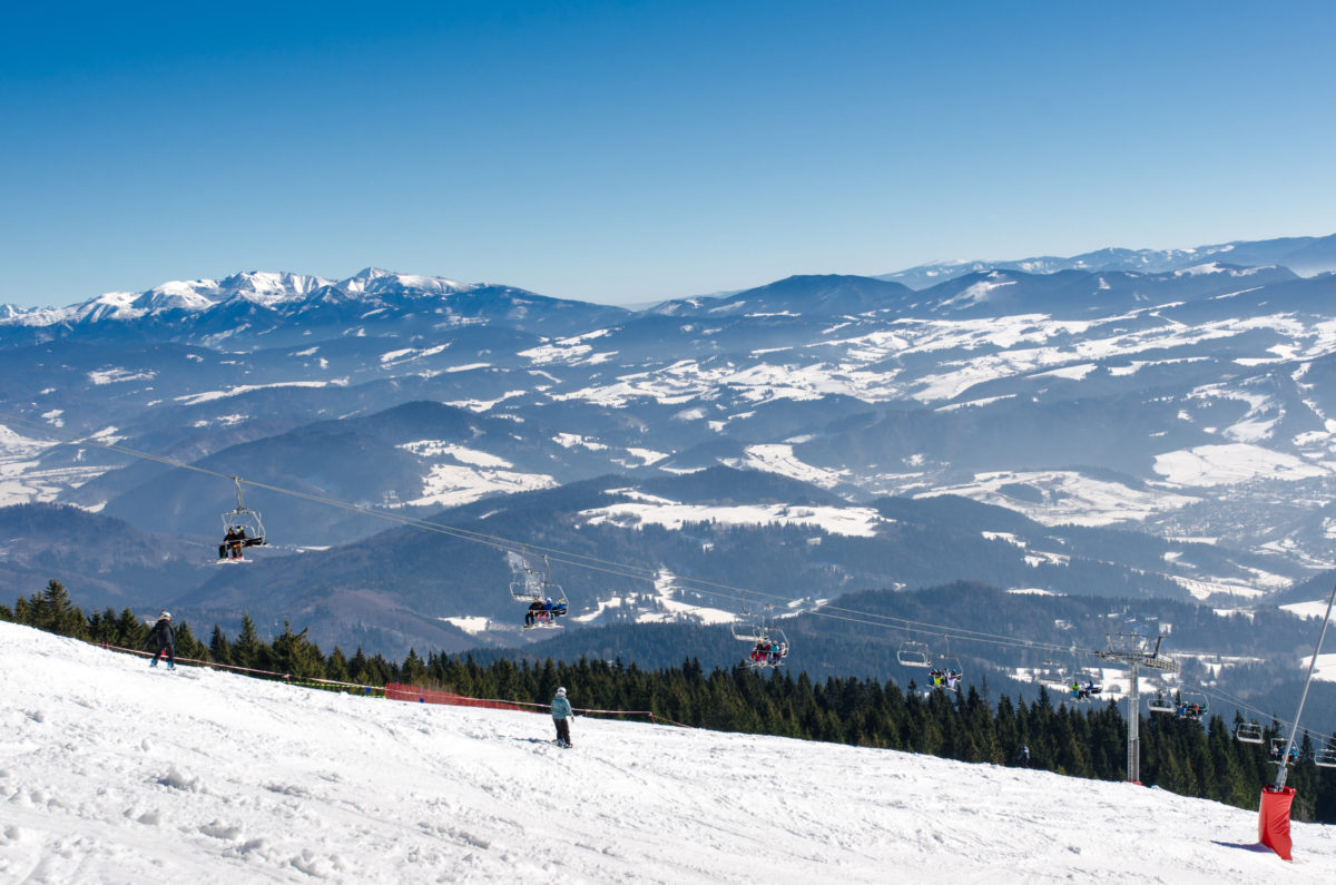 Chair lift on the top of ski slope of skiing park Kubinska Hola in winter.