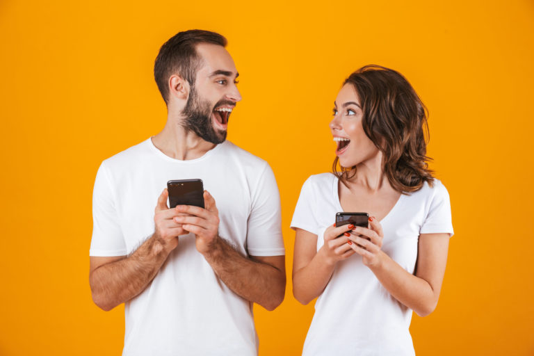 Image,Of,Excited,Couple,Man,And,Woman,Smiling,While,Both