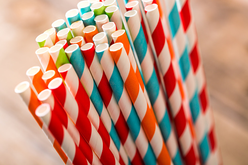 Striped paper straws in glass