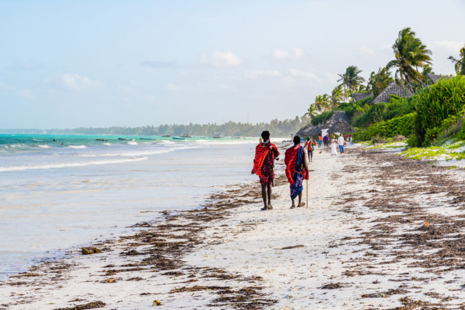 Two young maasai men at the beach. Zanzibar, Tanzania