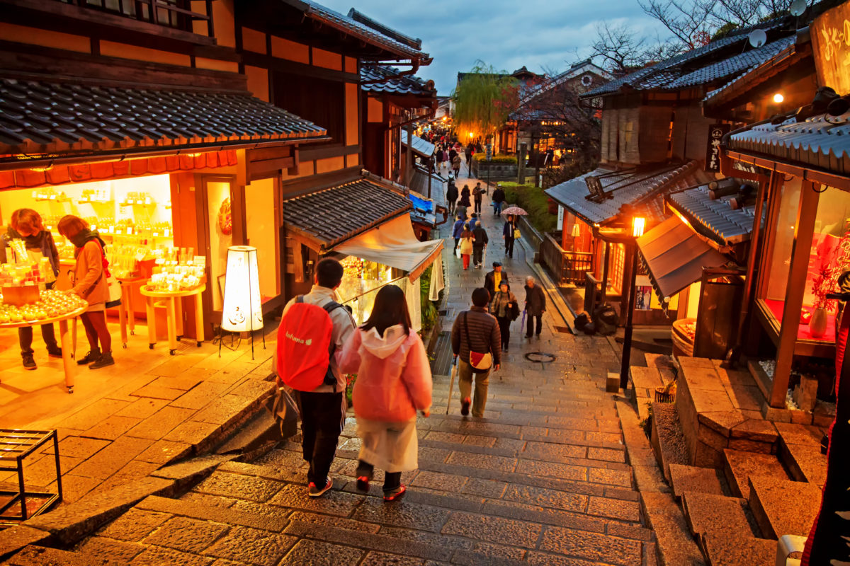 Tourists walk on a street leading to Kiyomizu Temple