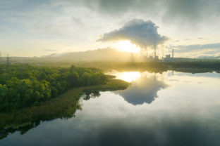 Aerial view coal power plant station in the morning mist.