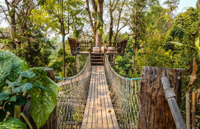 Suspension bridge in the forest on the mountain Doi Mon Cham near Chiang Mai, Thailand