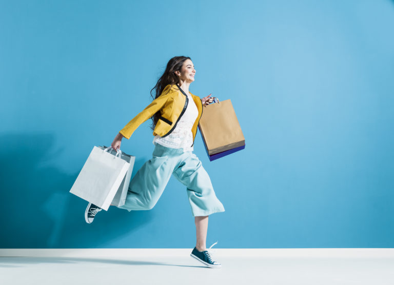 Cheerful happy woman enjoying shopping