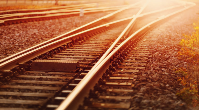 View of the crossing railway in sunset in summer.