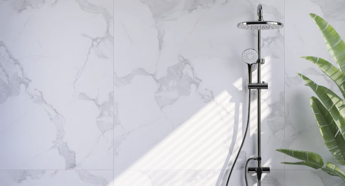 Modern and minimal bathroom design with shiny stainless steel rain shower, shower head on slide bar on beautiful white marble wall and banana tree with sunlight from window blinds