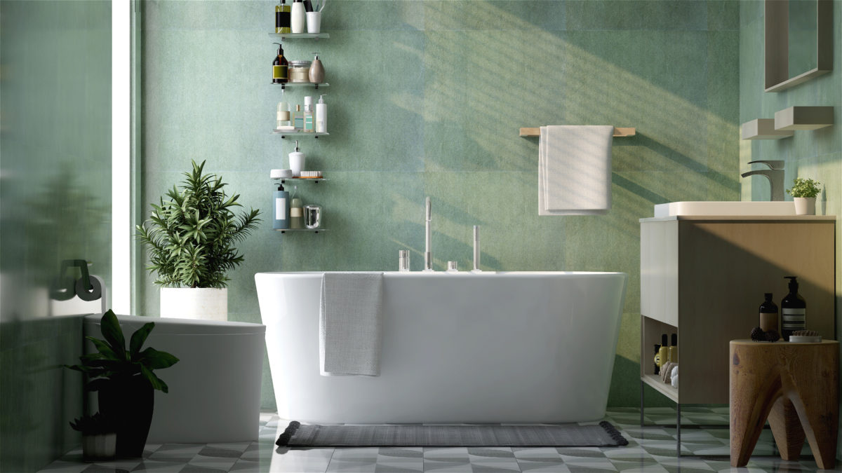 Modern and luxury design bathroom with bathtub, toilet bowl, vanity, washbasin, shelf and towel rail in sunlight from window on green granite wall and tile floor