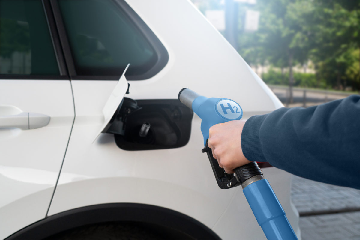 A man fuels a car with hydrogen.