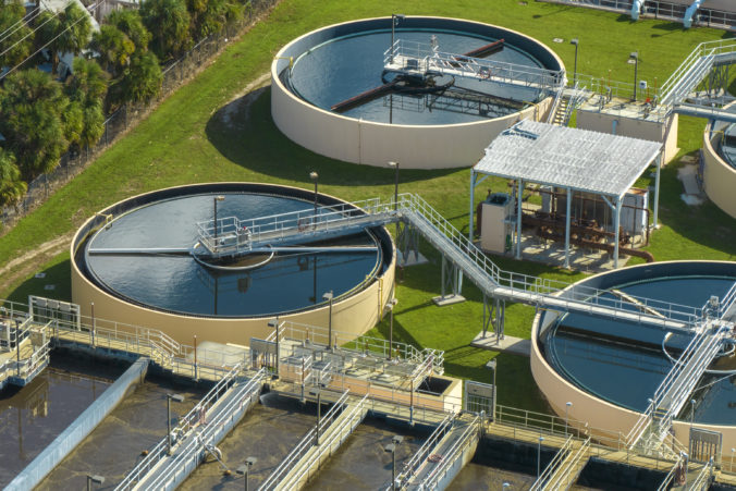 Aerial view of modern water cleaning facility at urban wastewater treatment plant. Purification process of removing undesirable chemicals, suspended solids and gases from contaminated liquid