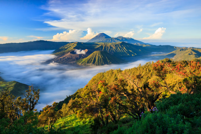 An aerial view of mountain tops in the fog
