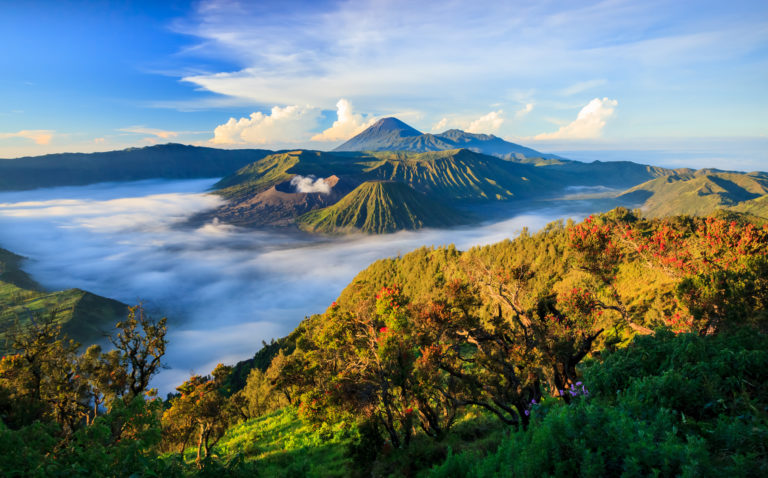 An aerial view of mountain tops in the fog