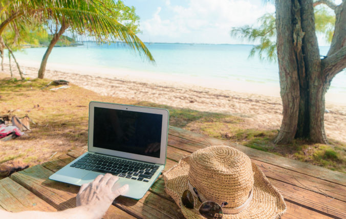 Blank Screen Laptop on Table at Beach