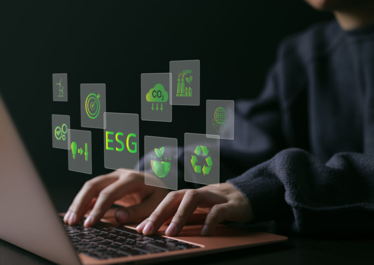 ESG environmental social governance investment business concept. woman uses a computer to analyze ESG data. ESG icons pop up on virtual screen in business sustainability investment strategy concept.
