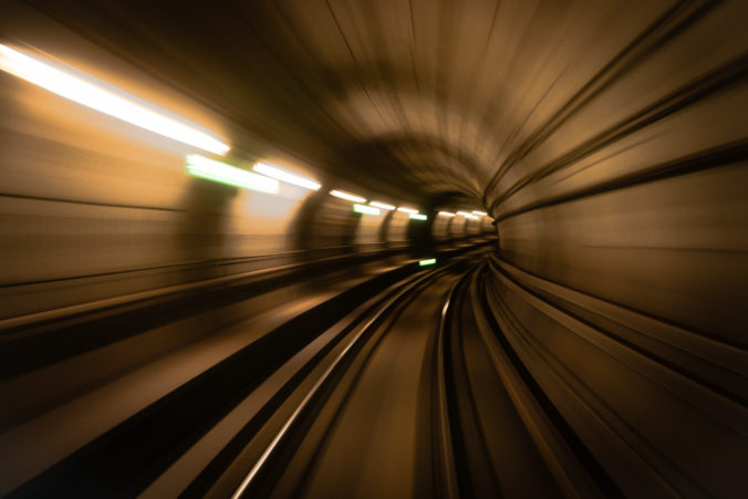 Subway train races through Copenhagen, Denmark, Metro Tunnel long exposure