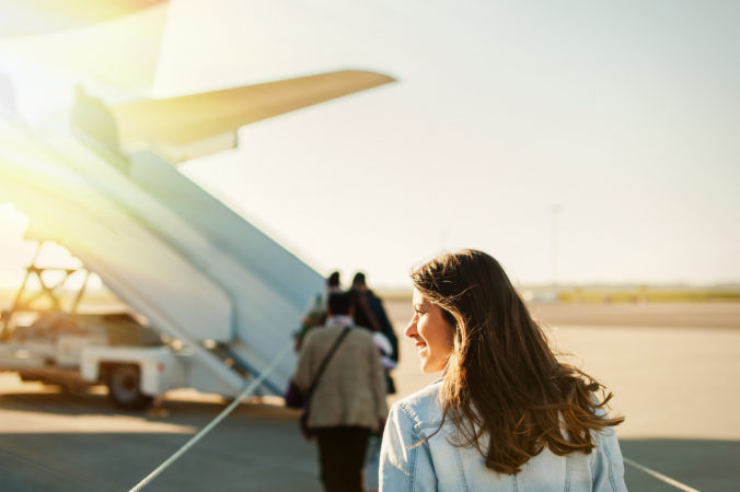 Pretty woman getting in to plane