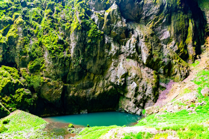 Macocha Abyss - large limestone gorge in Moravian Karst, Czech: Moravsky Kras, Czech Republic. View from bottom.