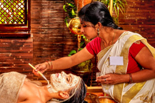 Woman having mask at ayurveda spa