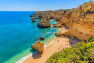 View of beautiful Marinha beach with crystal clear turquoise water near Carvoeiro town, Algarve region, Portugal