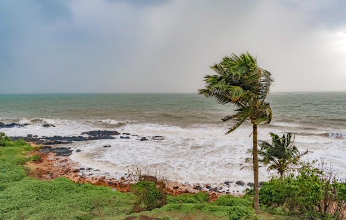 Climate change photo, taken during high speed cyclonic winds gushing through the coastal region, with heavy downpour taking place at horizon due to which it looks milky, and rain approaching coast.