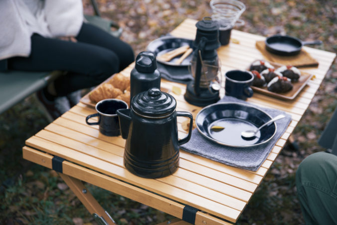 Image photo of women having lunch at a campsite