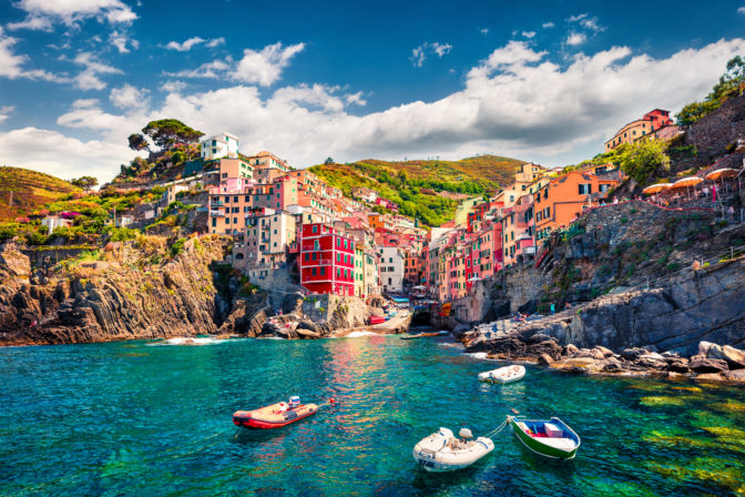 First city of the Cinque Terre sequence of hill cities - Riomaggiore. Colorful morning view of Liguria, Italy, Europe. Great spring seascape of Mediterranean sea. Traveling concept background.