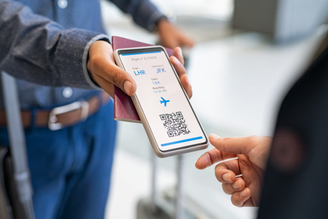 Man showing health vaccination passport to stewardess before flight