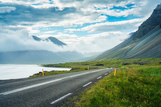 View from roadside with valley mountain with foggy on the road during summer in sunny day