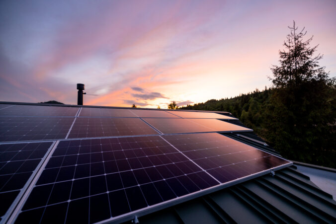 Rooftop with solar panels on house in mountains,