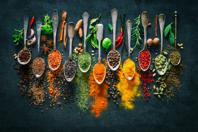 Herbs and spices for cooking on dark background