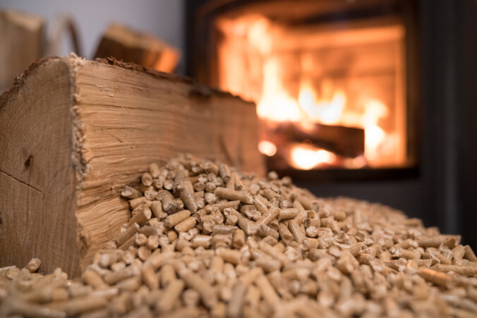 Wood stove heating with in foreground wood pellets