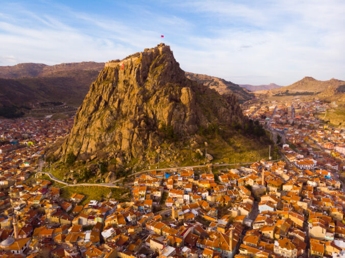 View from drone of Afyonkarahisar cityscape and rock with castle, Turkey