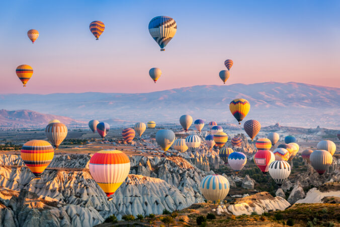 Aerial view of a fleet of hot air balloons, in Cappadocia, Turkey