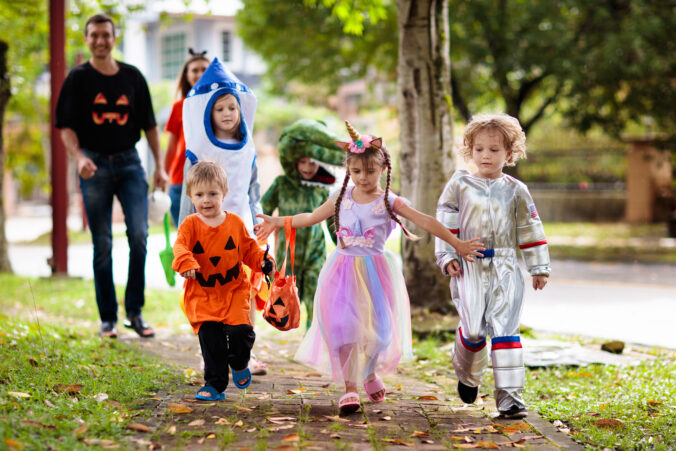 Kids trick or treat. Halloween fun for children.